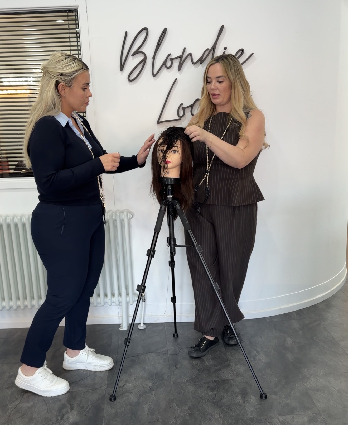 Nikki training a stylist at her Newcastle salon